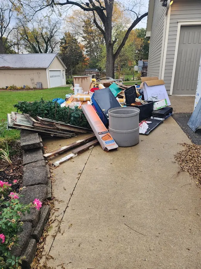 Dumpster being loaded with debris for 30 Yard Dumpster Rental in Cottonwood